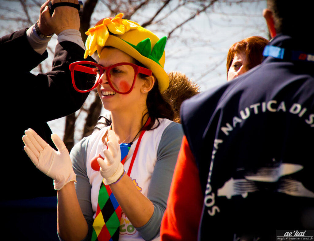 Clown-like woman waiting at the Finish Line at Lgo maggiore Marathon