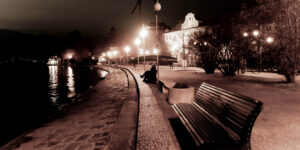 Sepia picture of a bench at night in Pallanza, Italy