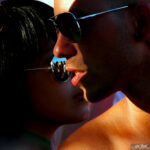 Silhouette Portrait of two people with sunshine highlighting one face at Streetparade in Zurich, Switzerland